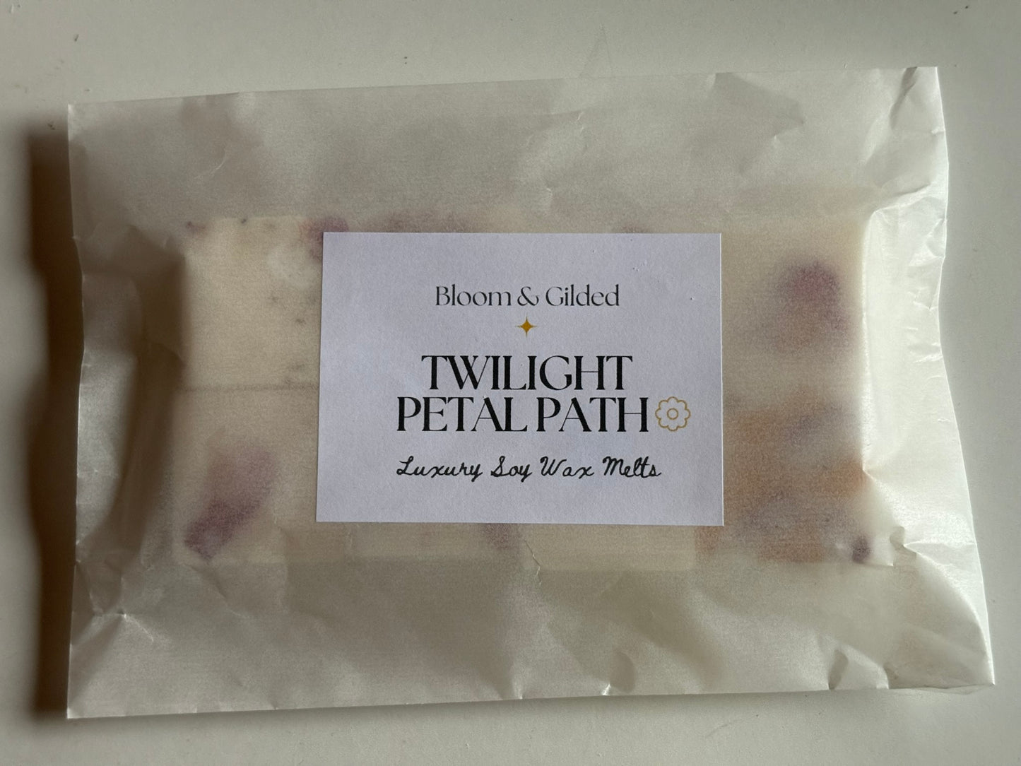  Twilight Petal Path Luxury Wax Melts - Peony Rose & Oud | Bloom and Gilded. Hand-poured luxury wax melts with peony, rose & oud. Adorned with pink rosebud petals. Romantic & mysterious floral scent. UK made wax melts.